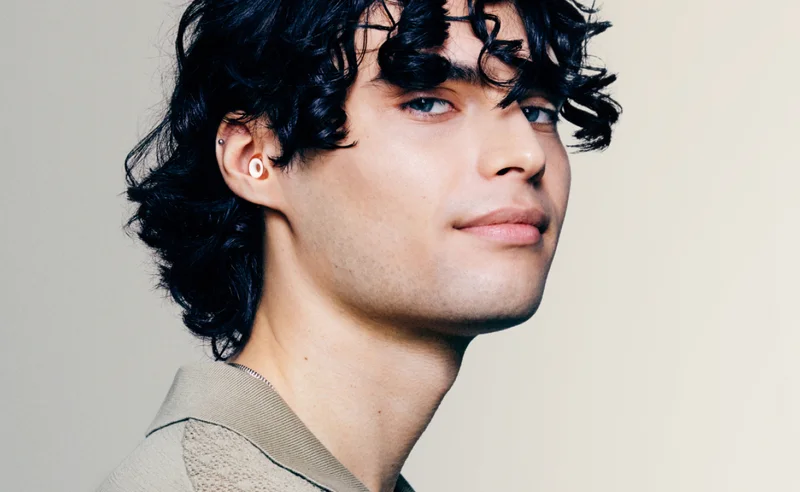 A man looking at the camera while wearing Loop Engage Plus.