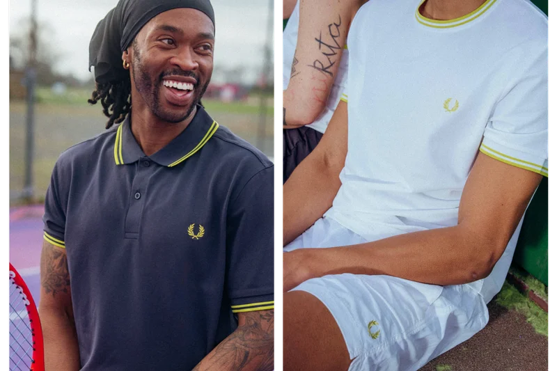 A male wearing the Tennis Fred Perry Shirt in Anchor Grey and a Tennis T-Shirt in white
