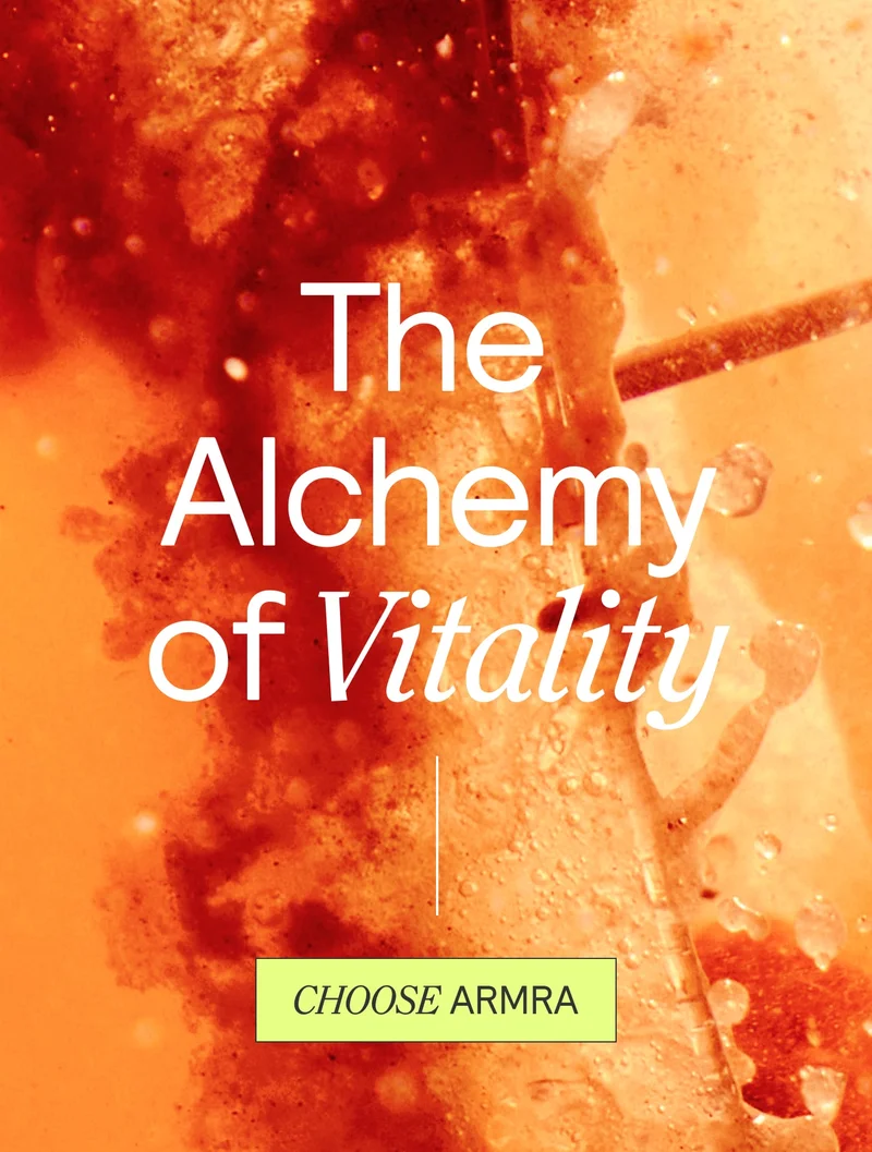 Vibrant orange fluid background with text reading ‘The Alchemy of Vitality’ in white and italicized ‘CHOOSE ARMRA’ in a yellow box beneath.