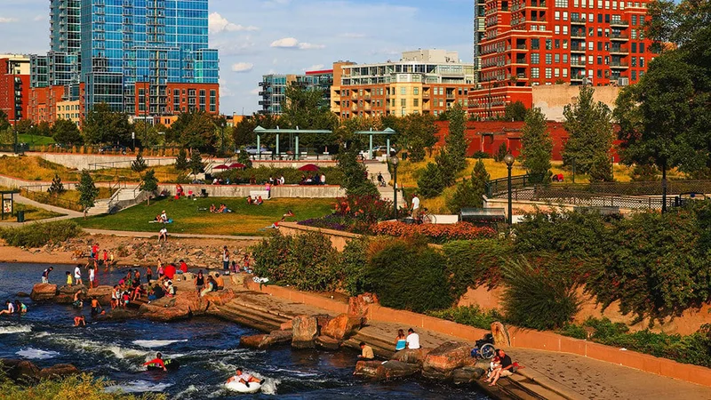Image description: People relaxing along the Platte River, in Denver.