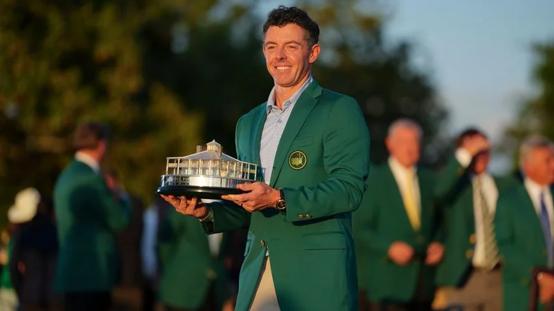 Image may contain: Rory McIlroy, Adult, Person, Clothing, Coat, Face, and Head