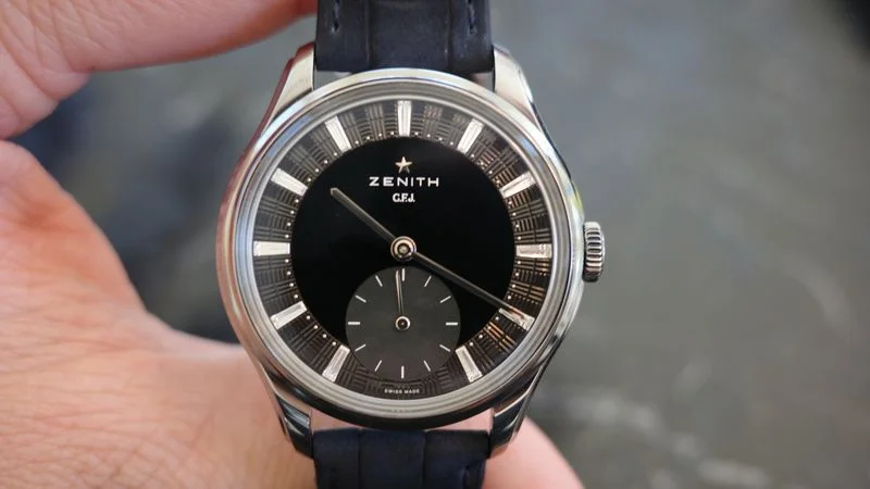 Image may contain: Wristwatch, Arm, Body Part, and Person