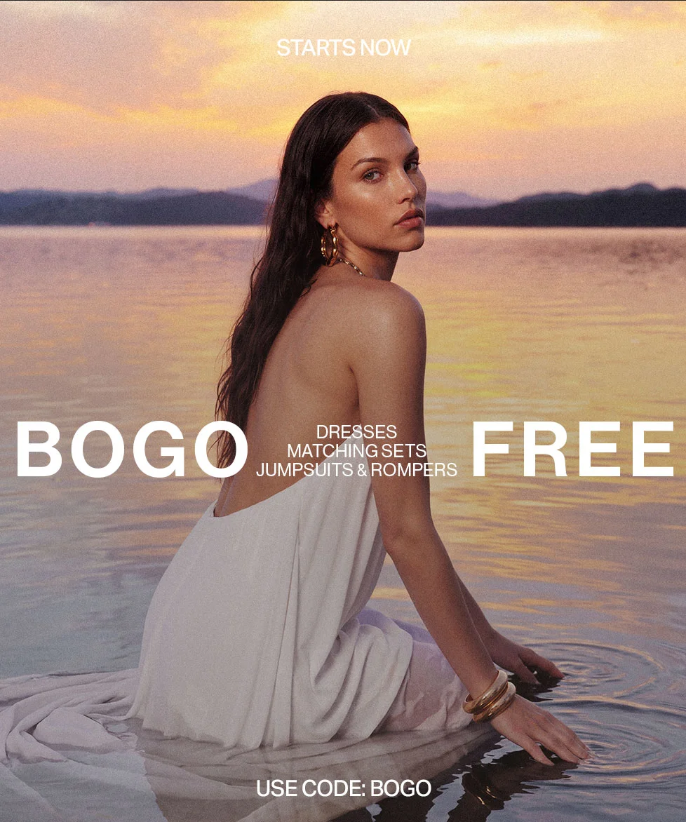 discount code FREE sale! Dresses, Matching Sets, Jumpsuits & Rompers. Shop new summer styles using code discount code. Woman in white dress in water.