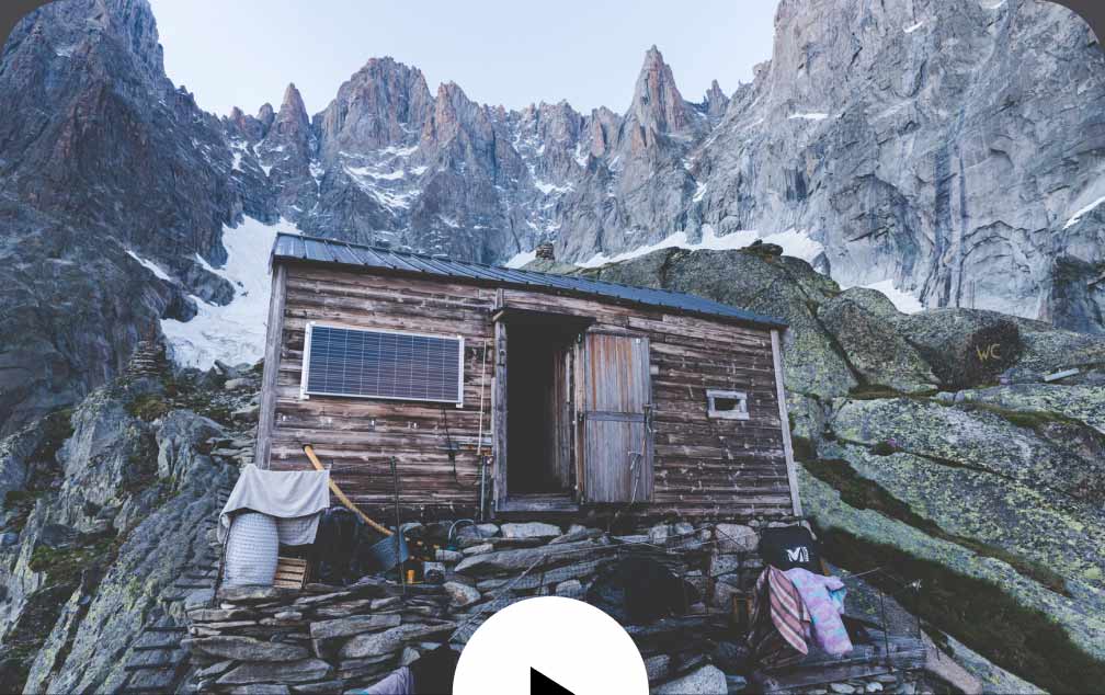 A small wooden hut perched high in the mountains.