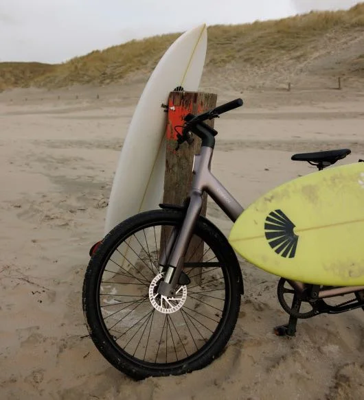A photograph of a Cross ST carrying a surfboard