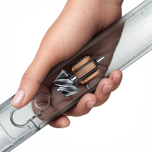 The Dyson PencilVac cleaner body fitting in the palm of a hand