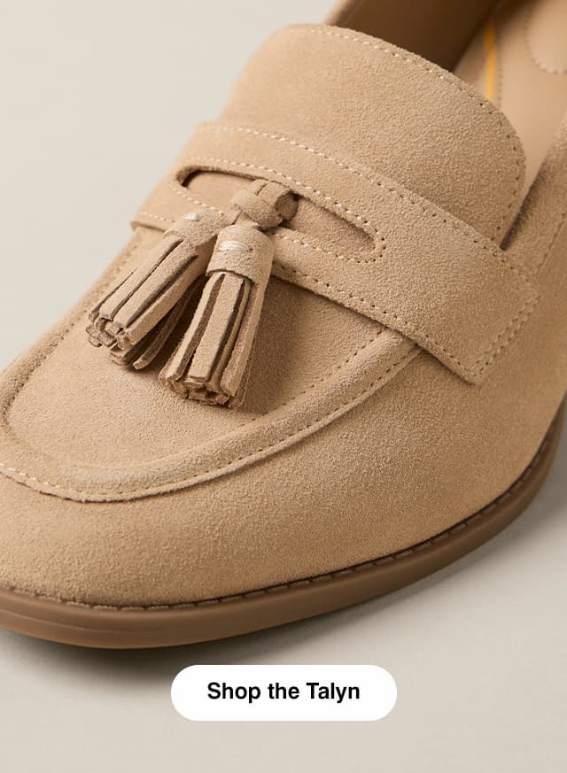 A close-up of the new heeled loafer in Light Tan suede featuring a penny strap, tassel, and apron toe.