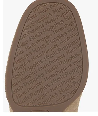 A close-up of the rubber outsole stamped with "Hush Puppies"