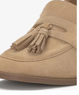 A close-up of the shoe's rounded square toe box and tassel detail.
