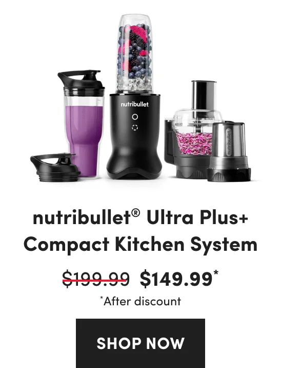 A collection of black blenders and a food processor containing berries, ice, and chopped purple vegetables.