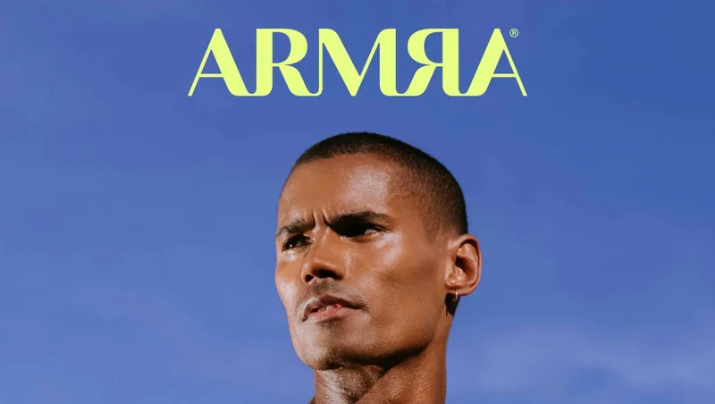 ARMRA logo in bright chartreuse lettering on a solid blue background.
