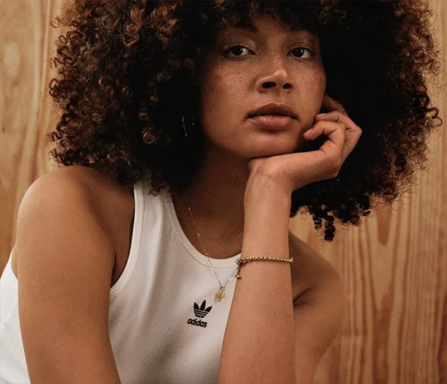 Rotating images of women modeling adidas sneakers