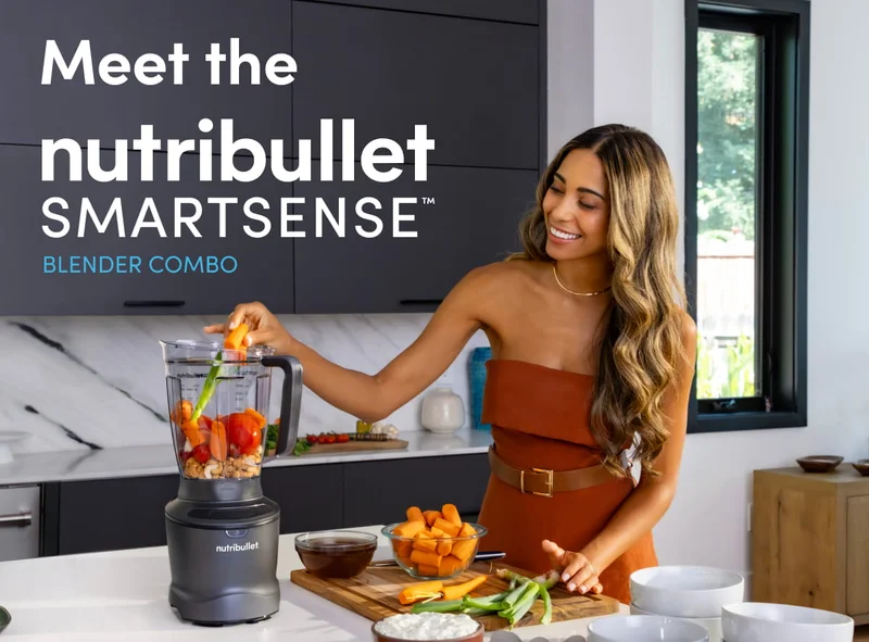 Smiling woman in a modern kitchen adds vegetables to a nutribullet SmartSense Blender on a white countertop, with the text 'Meet the Nutribullet SmartSense Blender' displayed.
