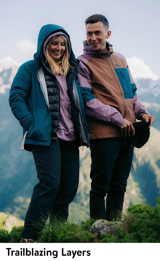 A woman wearing a hooded active jacket.  A man and woman wearing hooded active jackets.