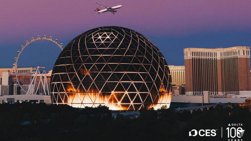An image of a Delta plane flying over Sphere in Las Vegas.
