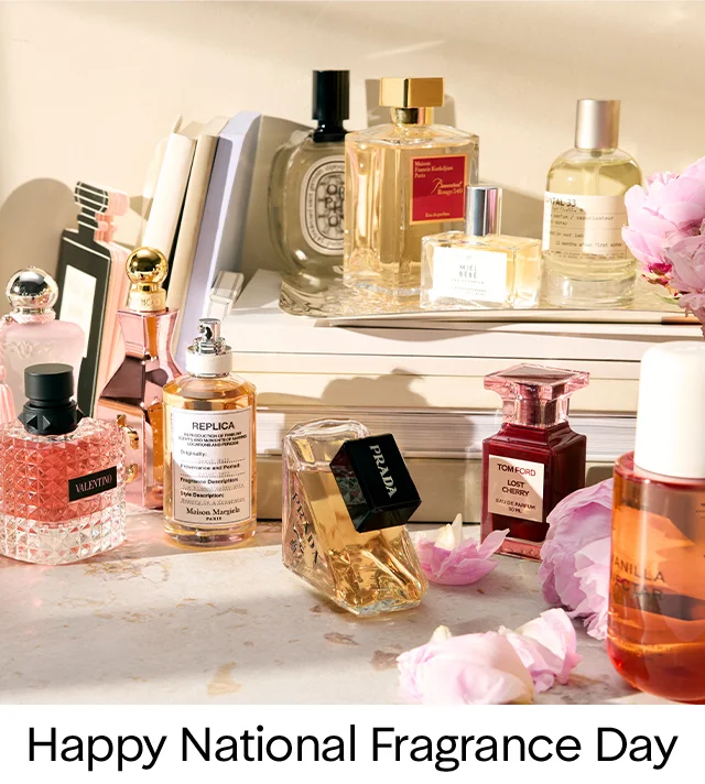 An assortment of perfume and cologne bottles on a countertop.