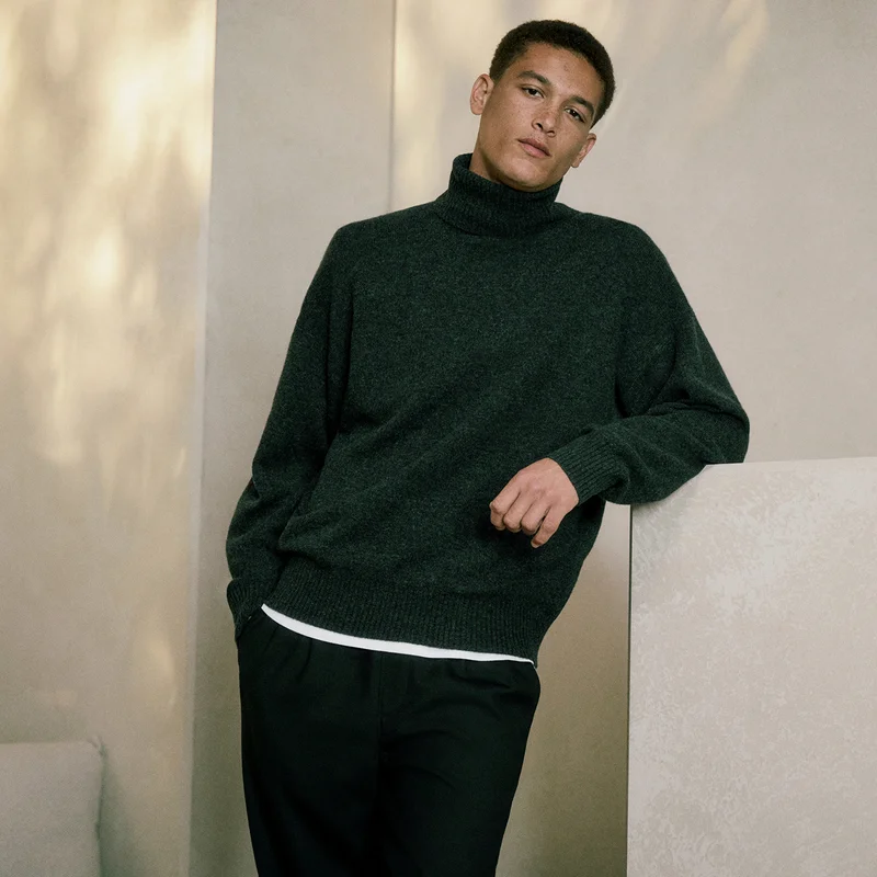 Image | Model in Luxe Merino Relaxed Turtleneck