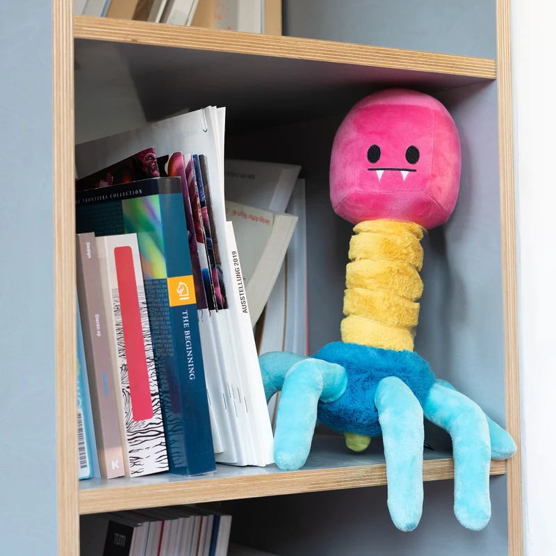 Bacteriophage Plushie sitting on a shelf