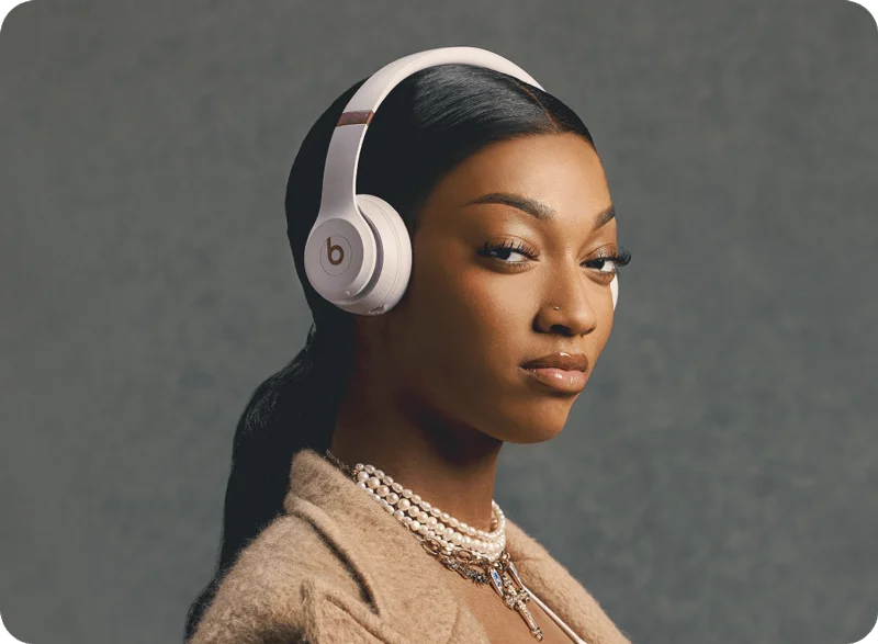 Angel Reese wearing Beats Solo 4 in Cloud Pink.