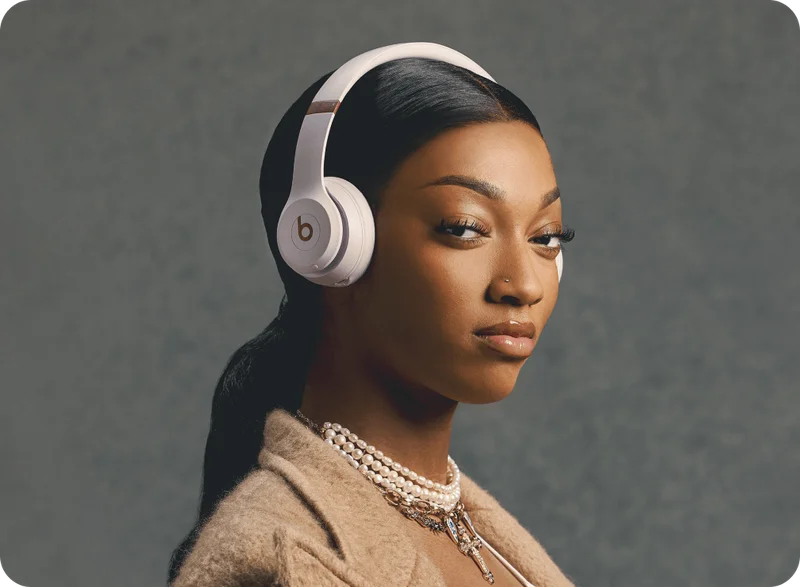 Angel Reese wearing Beats Solo 4 in Cloud Pink.