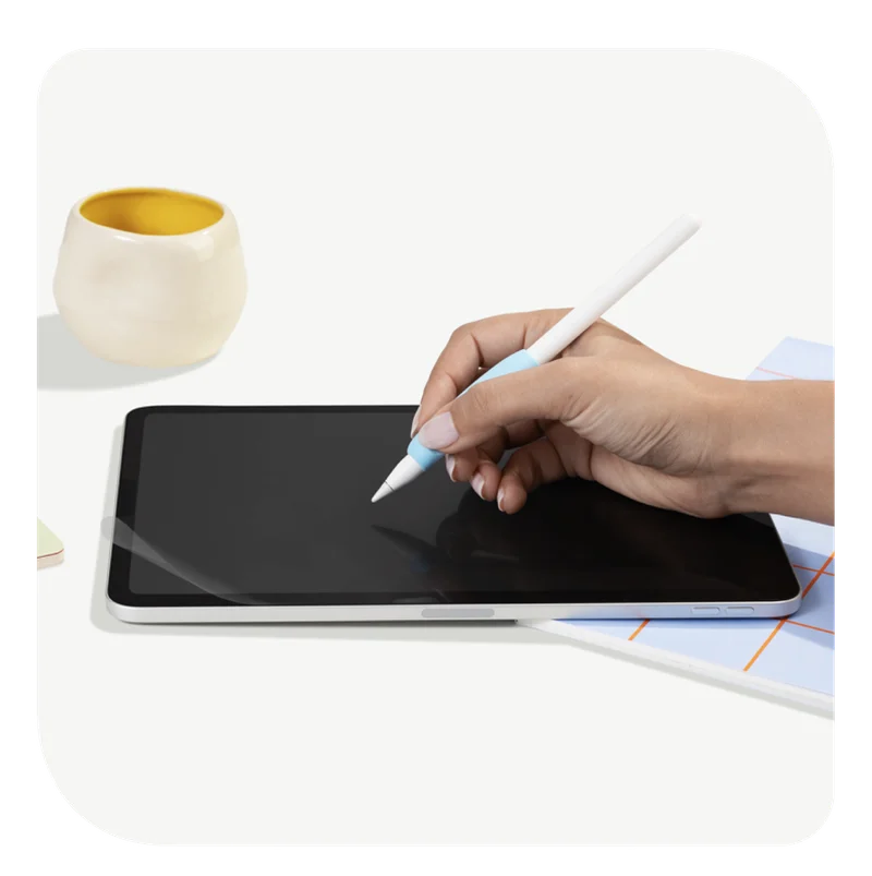 A hand holding Paperlike's Pencil Grip (2nd Generation) on top of an iPad