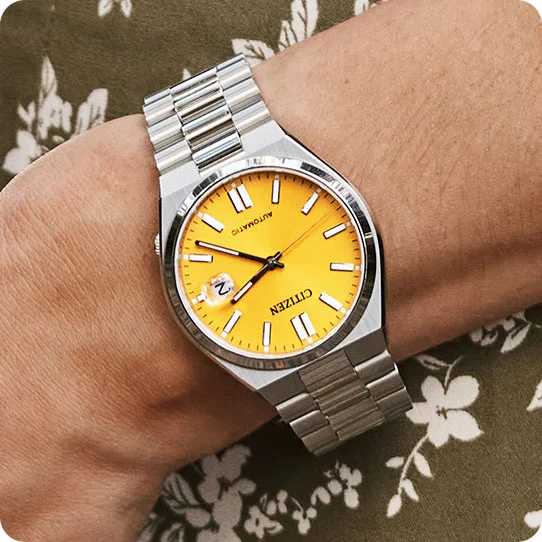 Woman wearing "TSUYOSA" yellow watch