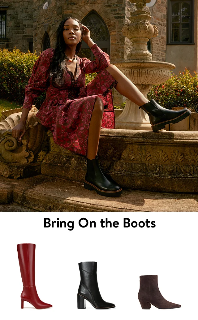 A woman wearing a dress and combat boots. Black, red and brown boots.