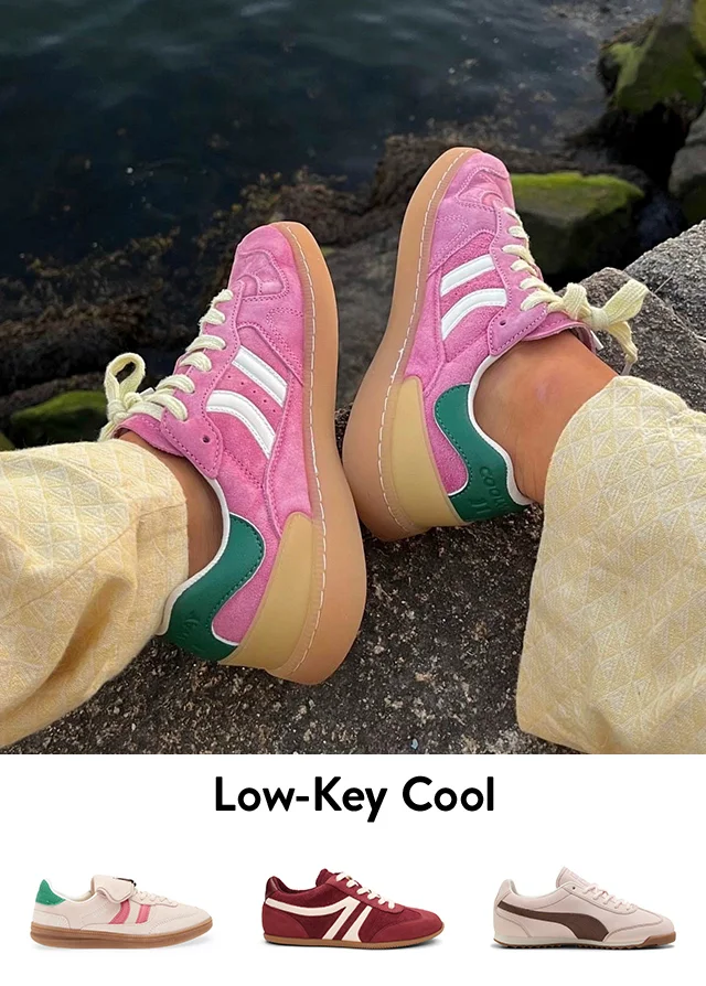 A pair of bright pink sneakers. Maroon sneakers and white sneakers with colorful accents.