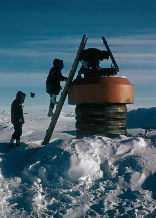 Workers test one of the polar station’s 15 escape hatches. When this image and others appeared in the May 1962 issue of National Geographic, the camp was celebrated as an engineering marvel— though its true Cold War mission as a covert nuclear base was still classified information