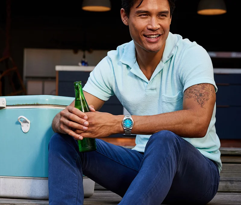 Man wearing the "Tsuyosa" teal watch
