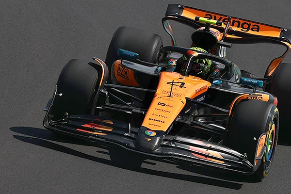 A McLaren Formula One race car speeding down a track.