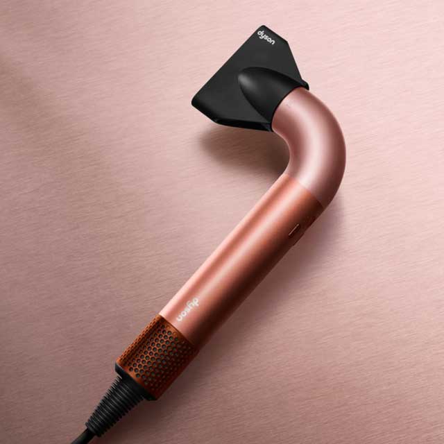 Close up of Dyson Supersonic r™ hair dryer in Amber Silk