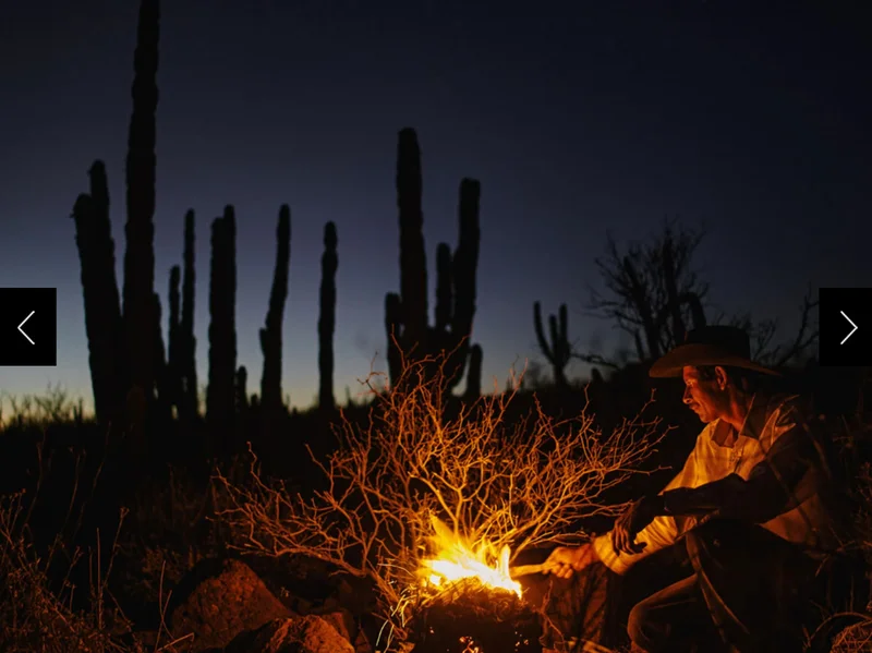Eleonary 'Nary' Arce Aguilar lights a fire while driving his animals around in search of feed near Rancho Mesa San Esteban in the Sierra de San Francisco of Baja California Sur, México.