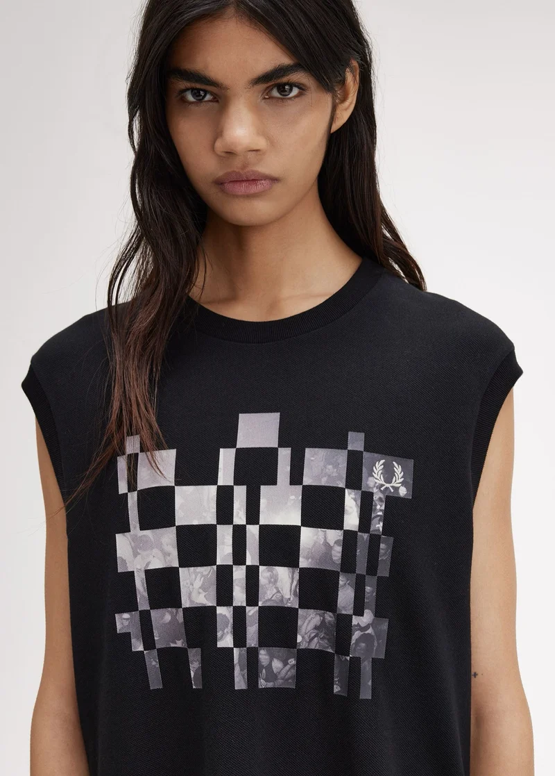 Female model wearing a chequerboard graphic tank
