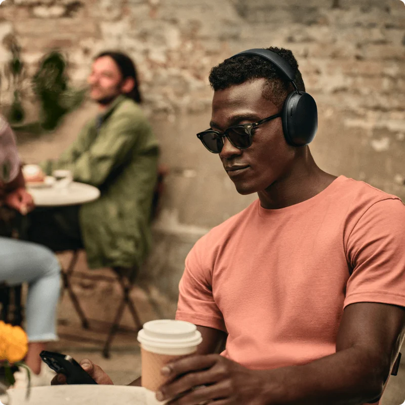 Sonos Ace man sitting at a restaurant table
