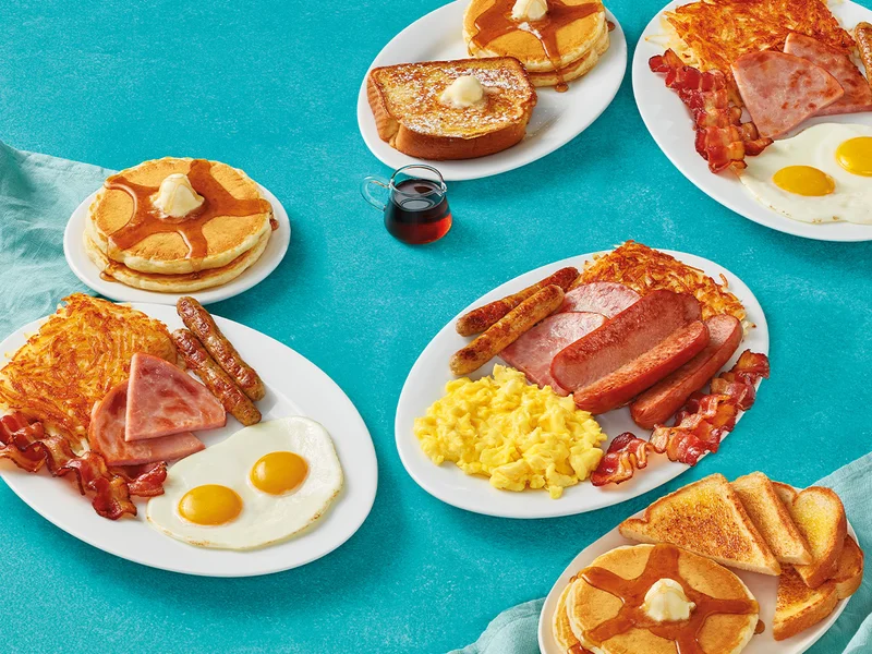 Ultimate BreakFEASTs set on a textured blue tablecloth.