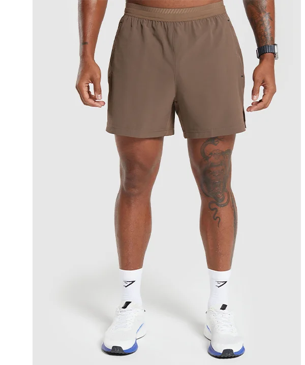 Featuring the Apex 5'' Hybrid Shorts in soft brown.