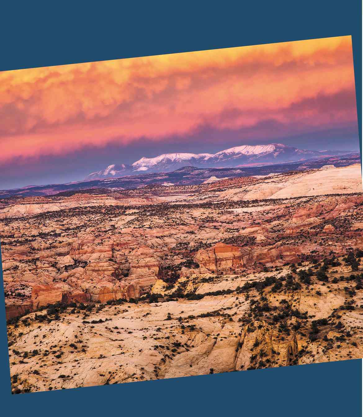 A rocky landscape with a cloudy pink sky.