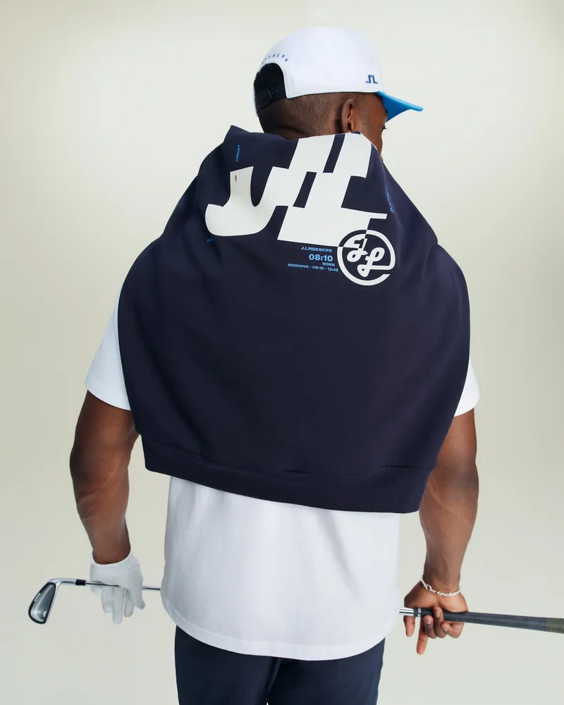 an image of a man holding a golf club and a golf ball