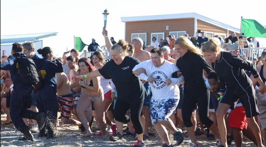 John running into the freezing water for the polar plunge
