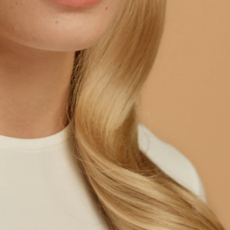 Close-up of straight blonde hair.