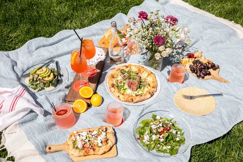 AperiBar picnic foods on a blanket in Bryant Park