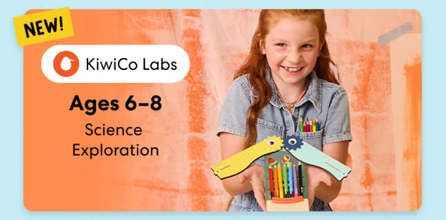 Young girl smiling while working on a science experiment from KiwiCo Labs. Hands-on STEM learning for ages 6–8.
