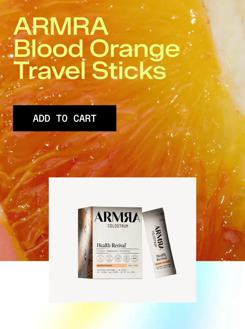 ARMRA Blood Orange Travel Sticks packaging shown over a close-up blood orange background.