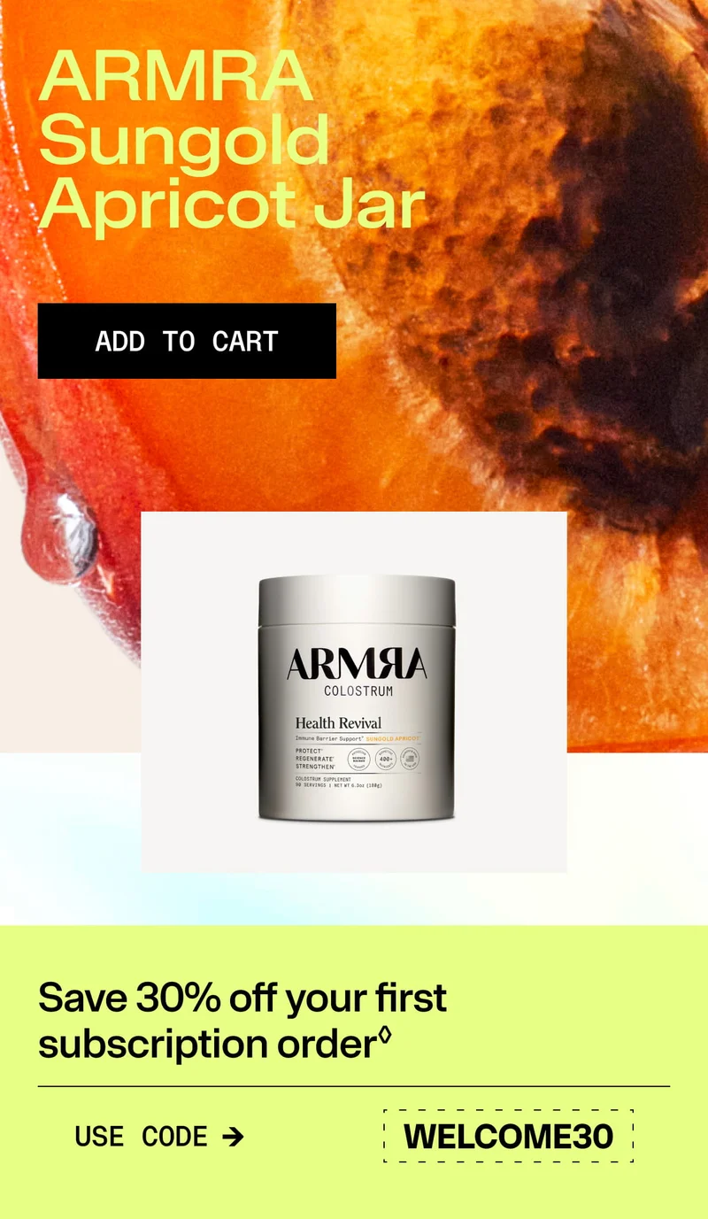 ARMRA Sungold Apricot Colostrum jar displayed over a close-up apricot background.