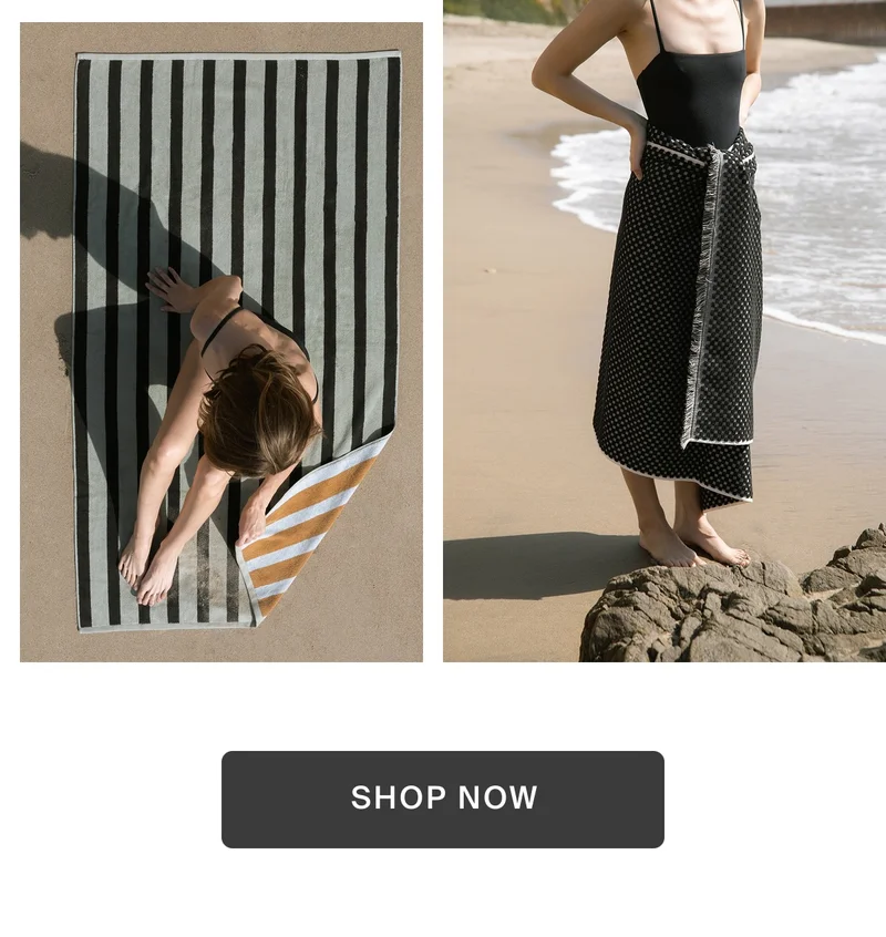 Woman on beach with premium beach towels.