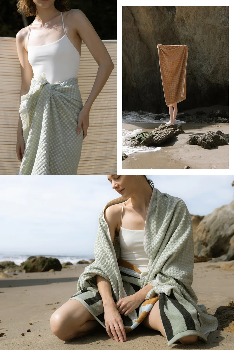 Woman on beach with premium beach towel.