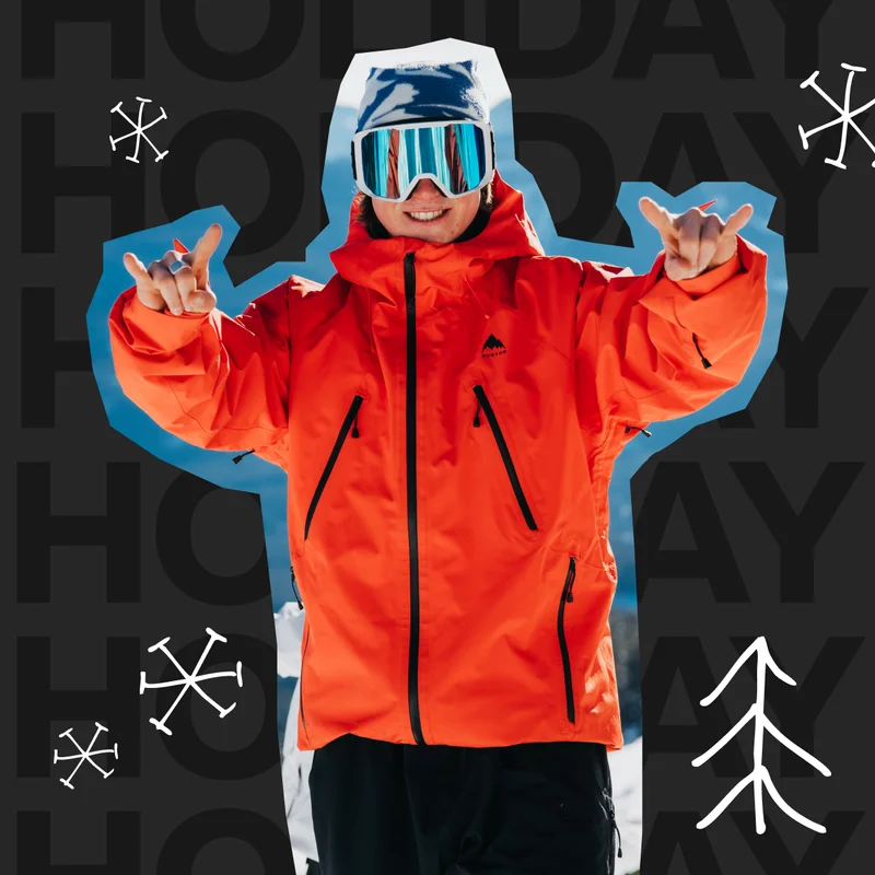 Cut-out image of a snowboarder looking at the camera wearing a Burton Reserve Jacket in Red and Pants in Black.