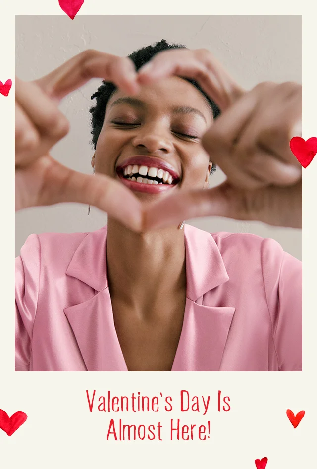 Woman making a heart sign.
