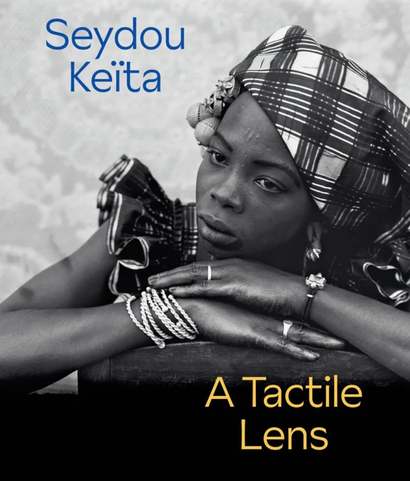 Book cover depicting a black-and-white portrait of a woman with text overlay reading "Seydou Keïta: A Tactile Lens"